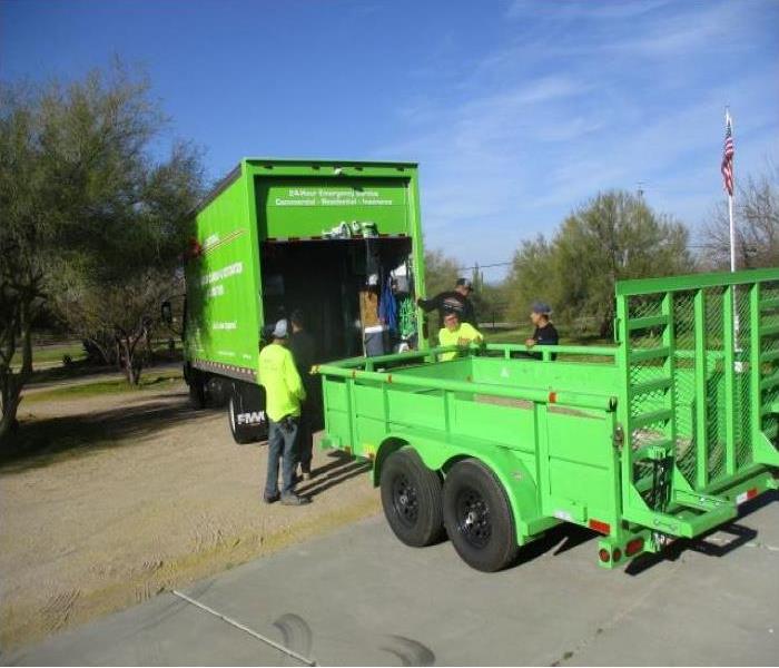 SERVPRO employees unloading SERVPRO truck