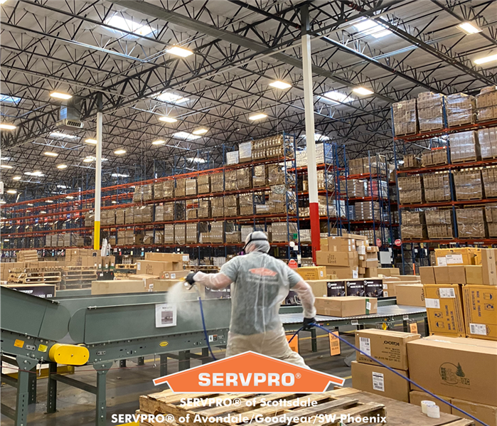Photo of SERVPRO technician fogging building